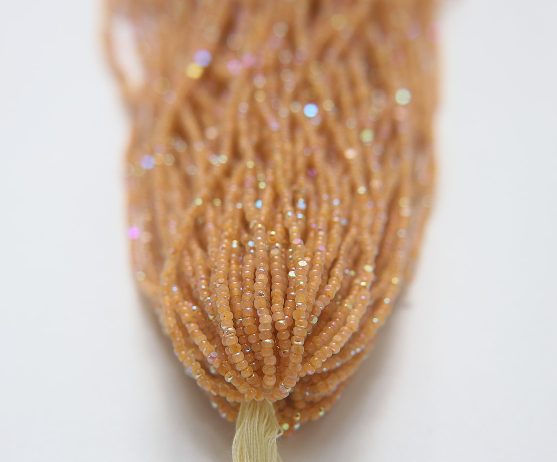 11/0 Charlotte Cut Seed Beads Patina Neon Sun Opal AB Hanks