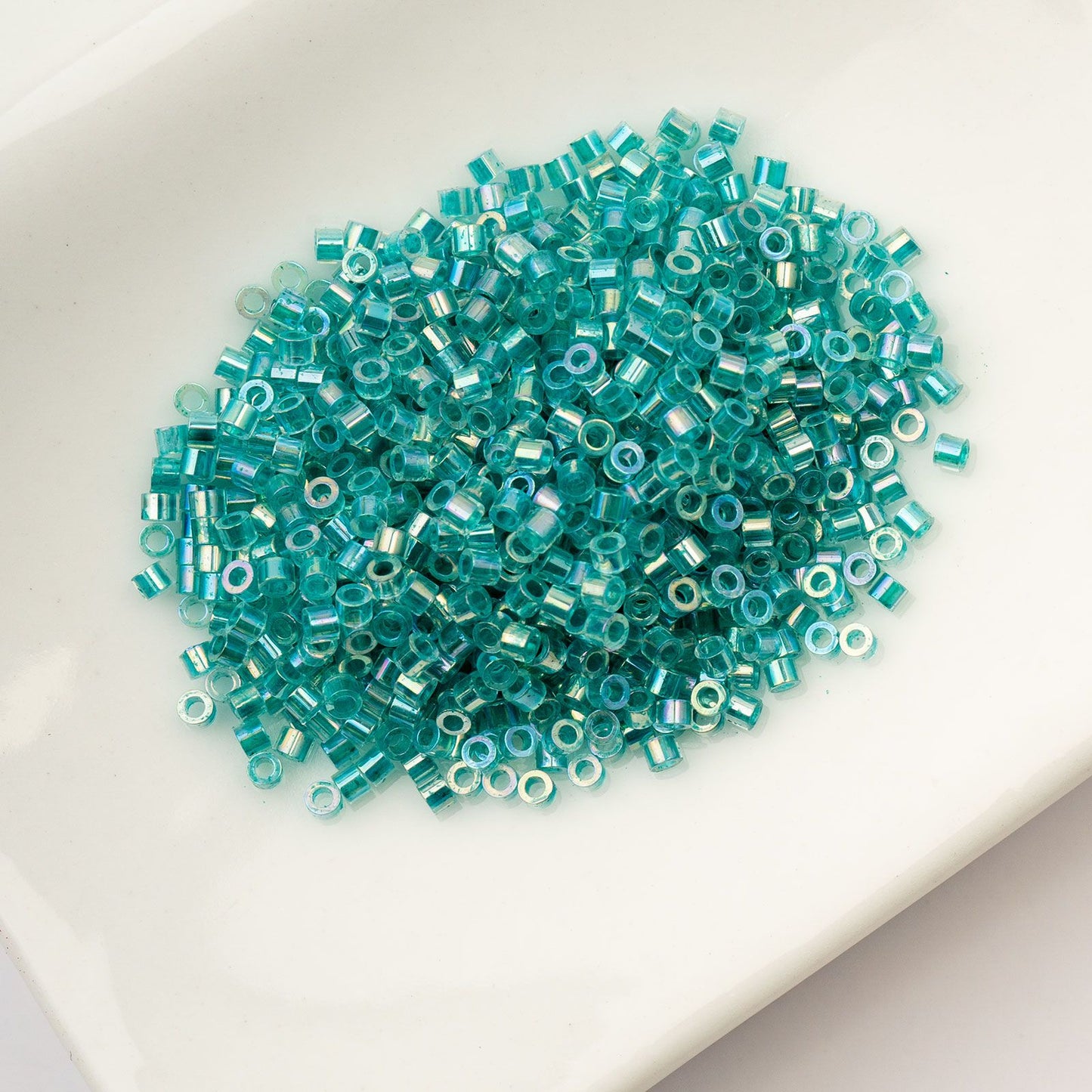 Cylin Bead 11/0 Transparent Teal Caribbean AB