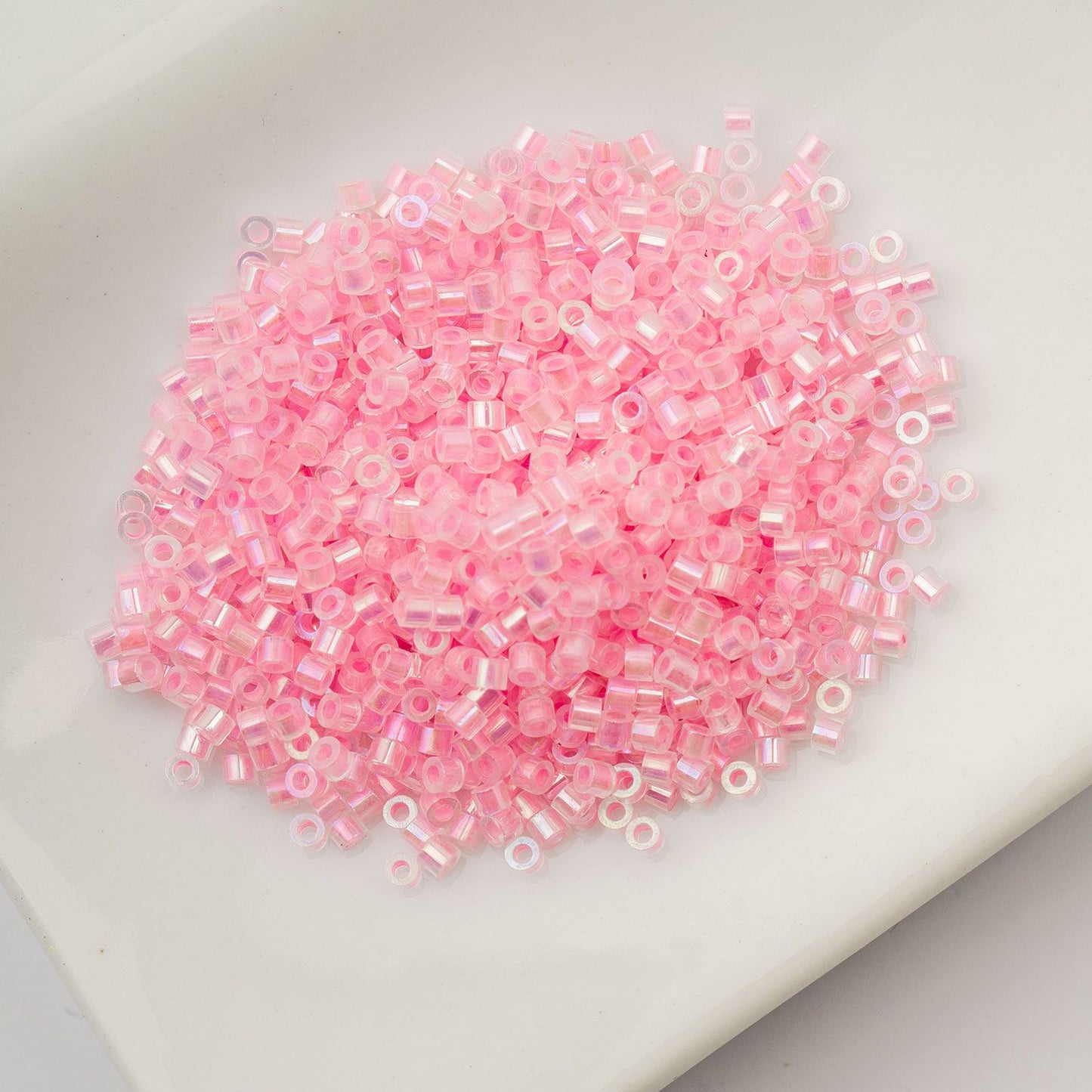 Cylin Bead 11/0 Glow in Dark AB Pink