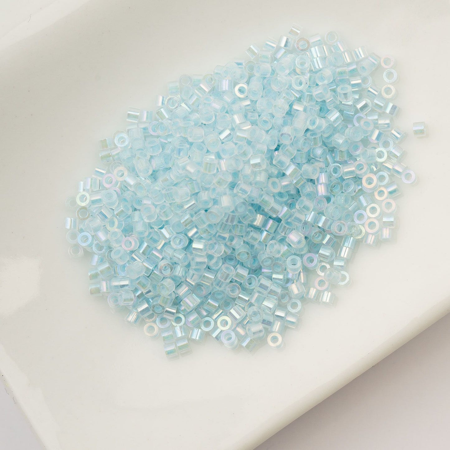 Cylin Bead 11/0 Glow in Dark AB Sky