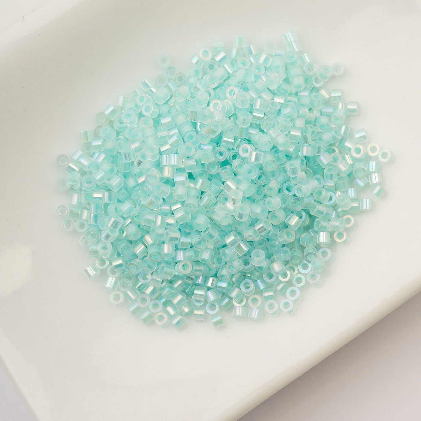 Cylin Bead 11/0 Glow in Dark AB Turquoise